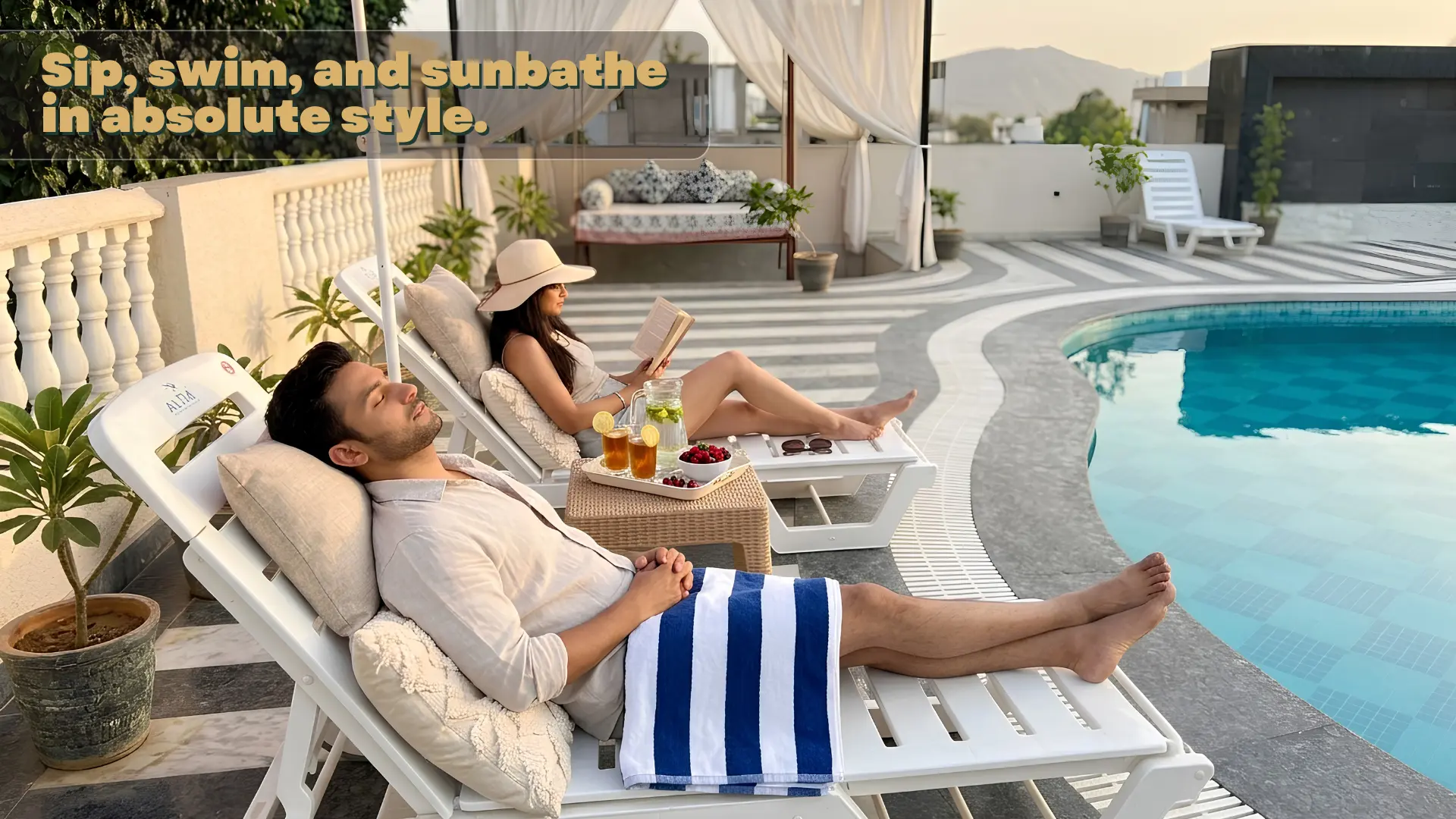 Guests relaxing on poolside loungers with refreshments